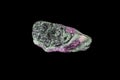 Ruby-Zoisite specimen. Black hornblende. Black background. Royalty Free Stock Photo