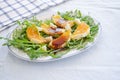 Ruccola salad with orange, cheese, sesame and balsamic