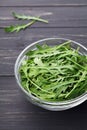 Rucola, salad rocket, rucoli, rugula, colewort, roquette or arugula on rustic table