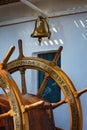 The rudder and ship's bell of a sail ship Royalty Free Stock Photo