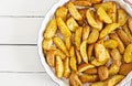 Ruddy Baked potato wedges with garlic Royalty Free Stock Photo