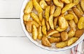 Ruddy Baked potato wedges with garlic Royalty Free Stock Photo