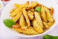 Ruddy Baked potato wedges with herbs Royalty Free Stock Photo