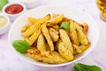 Ruddy Baked potato wedges with herbs Royalty Free Stock Photo