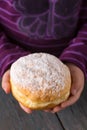 Ruddy delicious donuts berliners in children's hands
