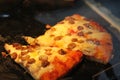 Ruddy dough. Italian pizza in the restaurant`s kitchen oven. Royalty Free Stock Photo
