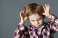 Rude kid playing with hands making face for determined attitude Royalty Free Stock Photo