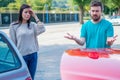 Two drivers arguing about damage to their cars after accident Royalty Free Stock Photo