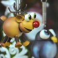 A Rudolph the Red Nosed Reindeer Ornament with a Penguin Royalty Free Stock Photo