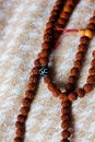 Rudraksha beads or rosary over a textile.