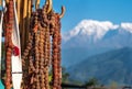 Rudraksha rosaries hanging on wooden hook