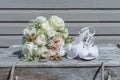 The Bride& x27;s White Chiffon Wedding Shoes with Bouquet Royalty Free Stock Photo