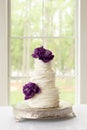 Ruffle Wedding Cake With Edible Purple Sugar Flowers Royalty Free Stock Photo