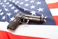 Ruffled national flag with hand gun over it series - United States Royalty Free Stock Photo