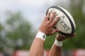 Rugby ball in hands Royalty Free Stock Photo