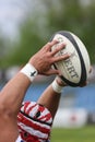 Rugby ball in hands Royalty Free Stock Photo