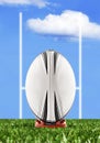 Rugby ball ready to be kicked over the goal posts Royalty Free Stock Photo