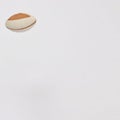Rugby ball on a white background in the upper left with copy space. Minimal american football scene
