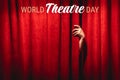 World theatre day background with text on top. March 27. The hand on the red curtain background.