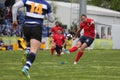 Rugby player kicking the ball