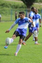 Rugby player kicking the ball