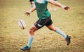 rugby player preparing to kick the oval ball during game Royalty Free Stock Photo
