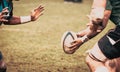 rugby player preparing to kick the oval ball during game Royalty Free Stock Photo