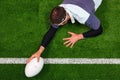 Rugby player scoring a try with one hand Royalty Free Stock Photo