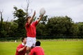 Rugby players jumping for line out Royalty Free Stock Photo