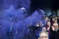 Rugby spectators in the stands celebrate an important victory with purple smoke grenades in AngoulÃÂªme, France