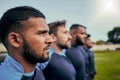 Rugby, sports and teamwork with men on field for training practice, fitness and challenge. Serious, power and Royalty Free Stock Photo