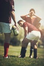 Rugby, start and fitness men with ball on a field with huddle, scrum and pitch, training and power outdoor. Energy Royalty Free Stock Photo