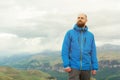 Rugged bearded man in in a membrane jacket headshot country masculine midwest mountain male