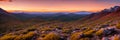 Rugged beauty of a mountain range at golden hour, with the sun setting in the background Royalty Free Stock Photo