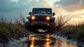 rugged car splashes through a muddy trail at sunset Royalty Free Stock Photo