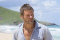 Rugged castaway man on deserted island Royalty Free Stock Photo