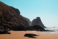 Rugged cliff-face and rock formations of Aftas Beach in the chill coastal town of Mirleft, Morocco. Royalty Free Stock Photo