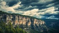 A Rugged Cliff Face Under a Dramatic Cloudy Sky Royalty Free Stock Photo