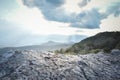 Rugged cliffs on foreground and clear sky view in the background at Phu Kra Dueng National Park, Loei Thailand.