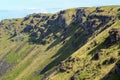 Rugged cliffs and greenery at Rano Kau crater, Easter Island Royalty Free Stock Photo