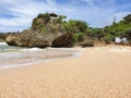 Rugged cliffs on the Indonesian coast beach Royalty Free Stock Photo