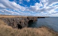 Rugged cliffs and ocean vista under a dramatic sky Royalty Free Stock Photo
