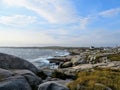 The rugged coast off of Peggys Peggys Cove Lighthouse, an active lighthouse and an iconic Canadian image, in Nova Scotia, Canada. Royalty Free Stock Photo