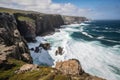 a rugged coast with towering cliffs, crashing waves and rocky beaches