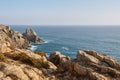 Rugged coastal cliffs and rocky terrain above calm ocean Royalty Free Stock Photo