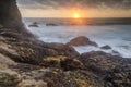 Rugged coastline sunset over Gray Whale Cove State Beach. Royalty Free Stock Photo