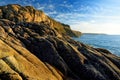 Rugged Cornish coastline at Porth Nanven on sunny evening, Cornwall, England Royalty Free Stock Photo