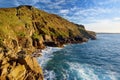 Rugged Cornish coastline at Porth Nanven on sunny evening, Cornwall, England Royalty Free Stock Photo