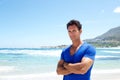 Rugged good looking man standing at the beach Royalty Free Stock Photo