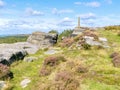 Rugged gritstone rocks lead up to Nelsons monument - HDR image Royalty Free Stock Photo